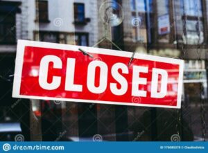 closed-shop-sign-window-reflections-176085378