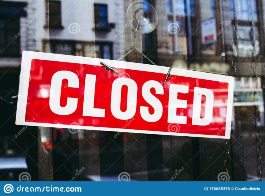 closed-shop-sign-window-reflections-176085378